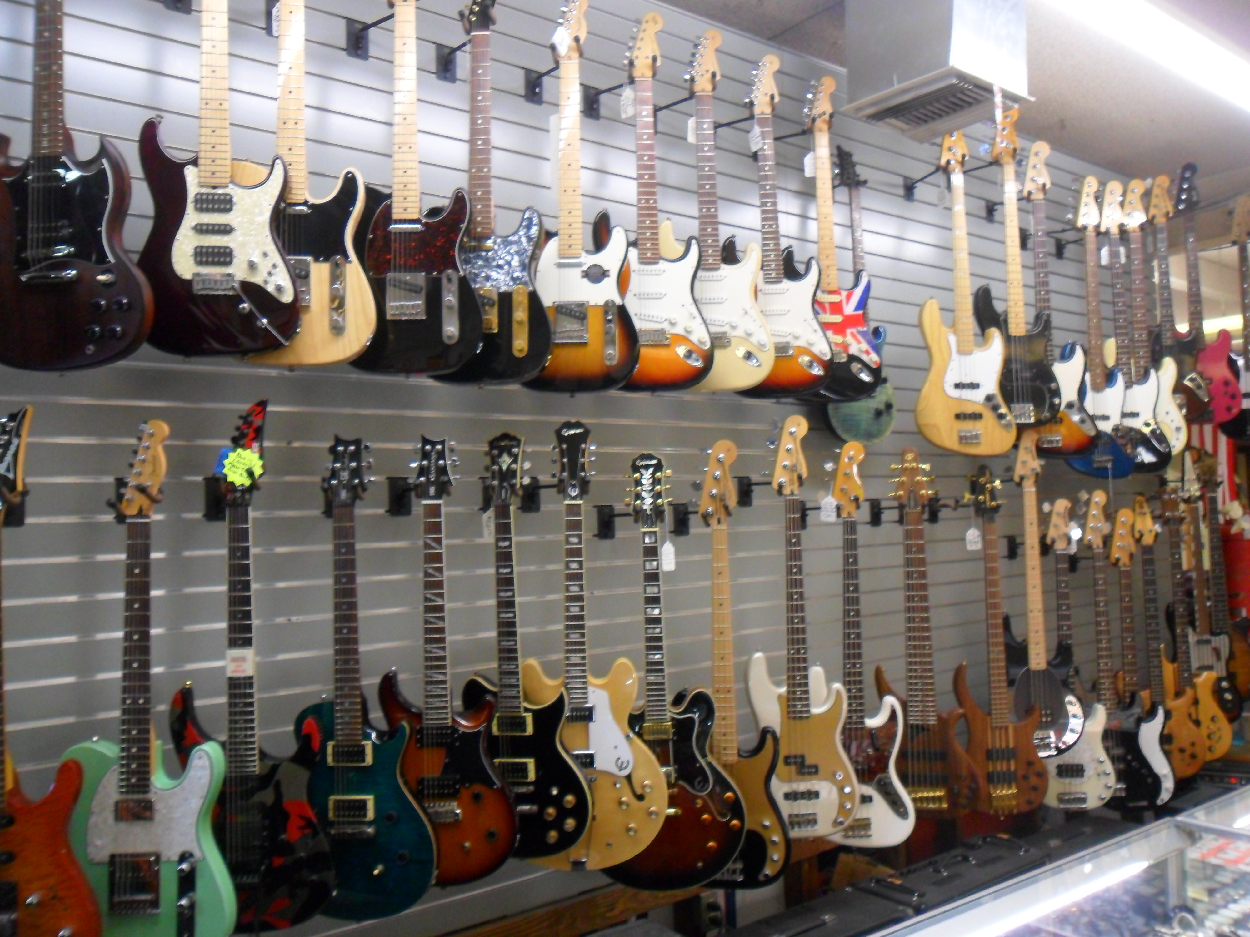 A wall of guitars at A&V Pawn Shop.