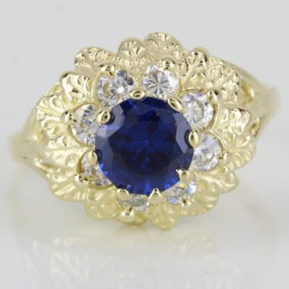 14k Yellow Gold Simulated Blue Gemstone and Halo CZ Cubic Zirconia Flower Ring - Image 2